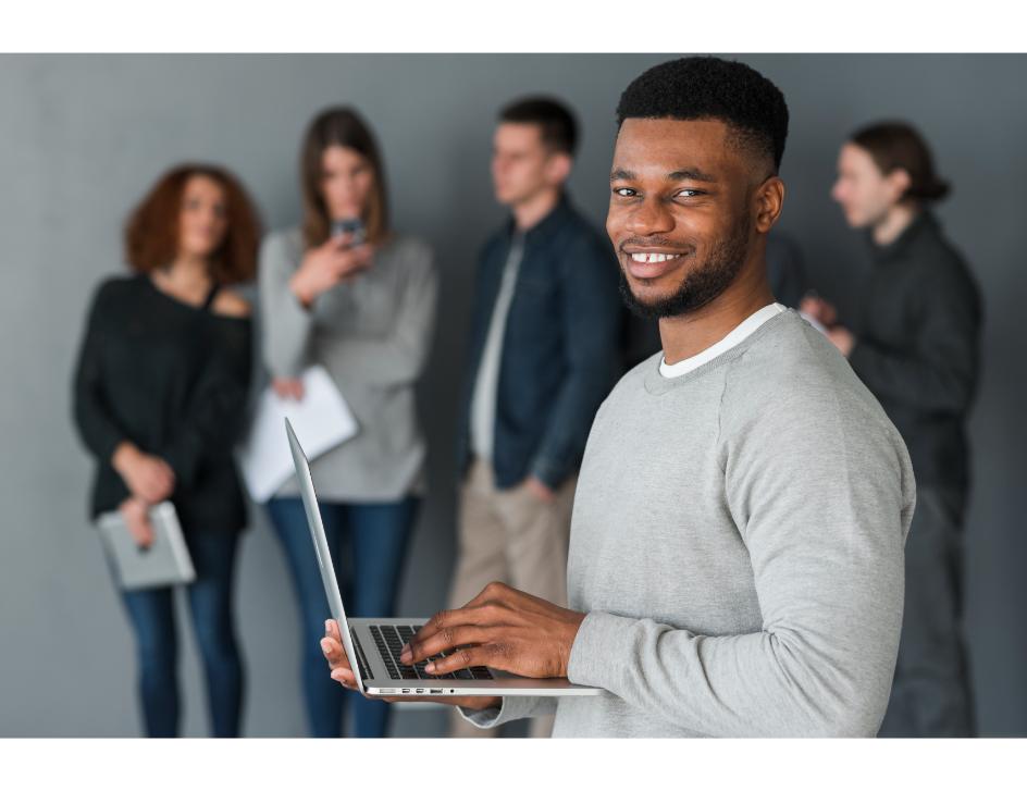 https://www.sourcequeencompany.com/wp-content/uploads/2026/07/man-with-laptop-front-people-1.jpg